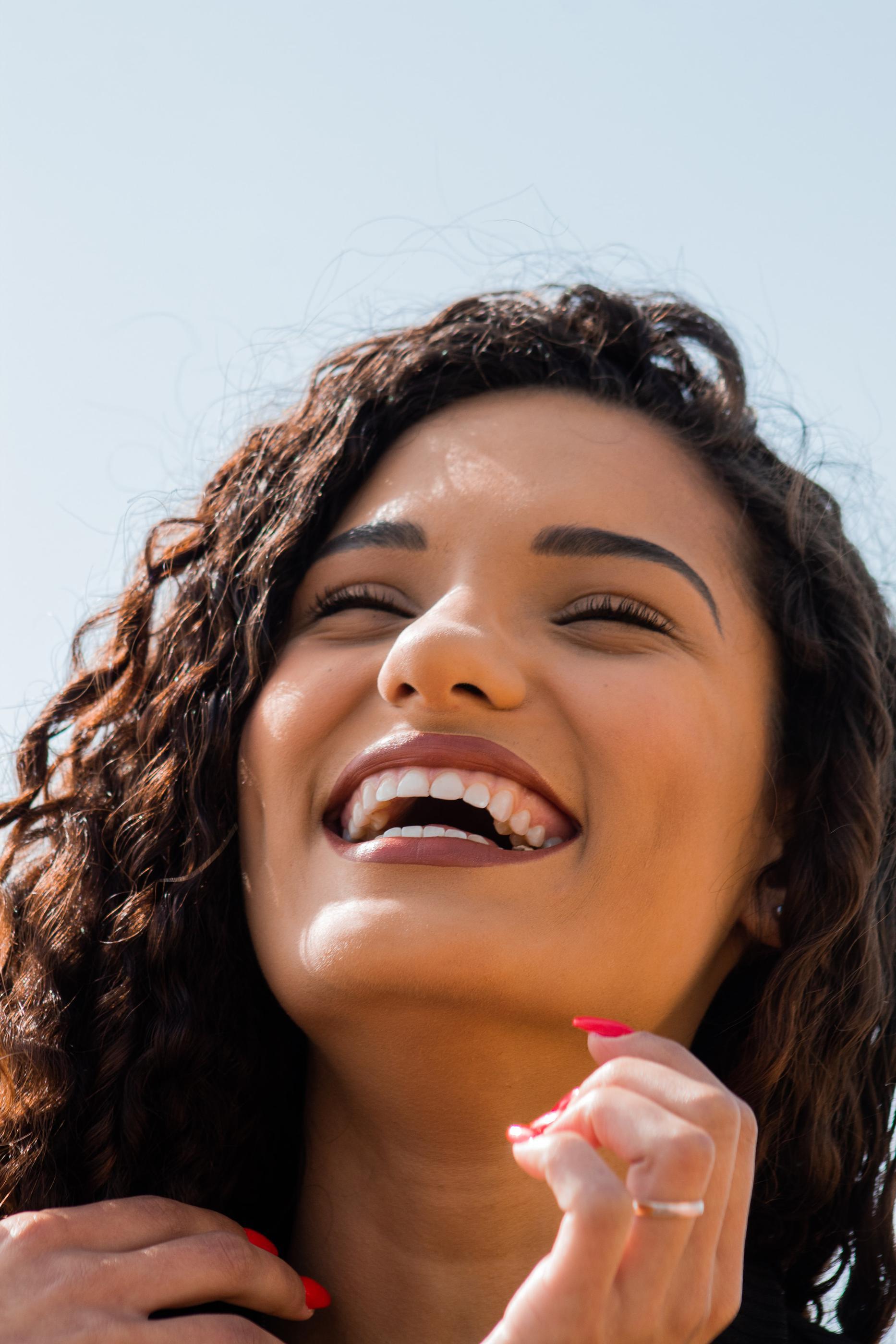 Woman with big smile in Huntington Beach