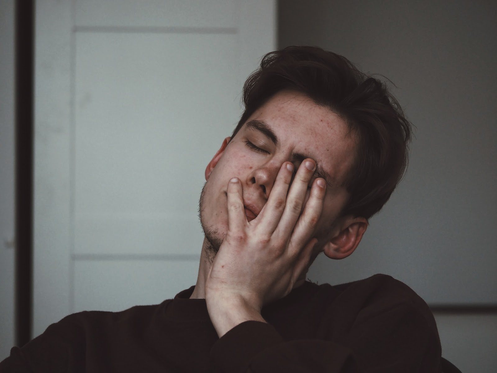 man with facial pain from TMJ